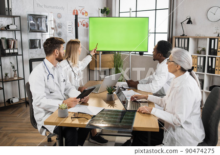 Multicultural doctors using monitor with green screen Multicultural doctors using monitor with green screen 90474275