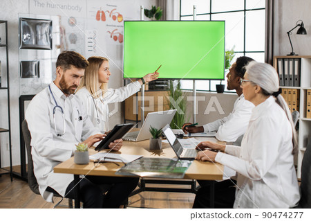 Multicultural doctors using monitor with green screen Multicultural doctors using monitor with green screen 90474277