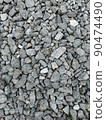 Texture close-up Gray granite, pebbles Road surface 90474490