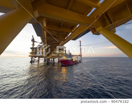 Offshore construction platform for production oil and gas. Oil and gas industry and hard work. Production platform and operation process by manual and auto function from control room. 90476182