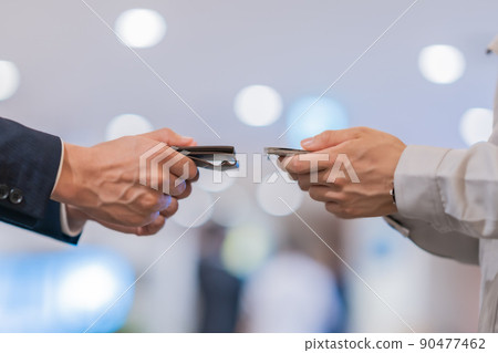 No face for engineers and businessmen exchanging business cards No face for engineers and businessmen exchanging business cards 90477462