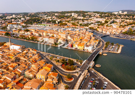 Aerial view of the administrative center with residential areas of the seaside town of Martigues 90478101