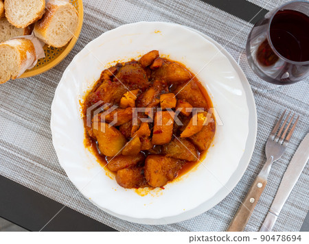 Patatas con sepia, stewed cuttle with potatoes 90478694