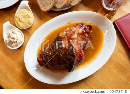 Pork knuckle with mustard, horseradish and bread Pork knuckle with mustard, horseradish and bread 90478748