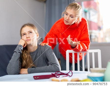 Sad teen girl after discord with her mother 90478753
