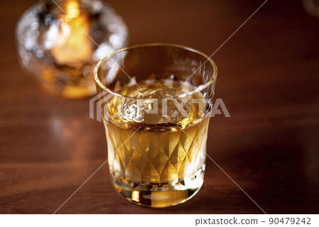 Whiskey poured into a glass Whiskey poured into a glass 90479242