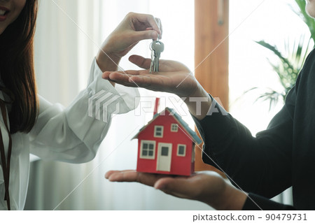 Businessman Holding House Keys. Businessman Holding House Keys. 90479731