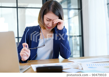 Portrait of business professional lady working at computer in the office or networking space. Portrait of business professional lady working at computer in the office or networking space. 90479910