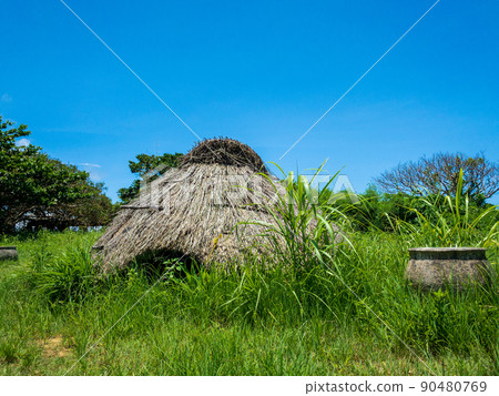 Nakabaru Ruins with a thatched roof on Ikei Island, Uruma City, Okinawa Prefecture on a sunny day Nakabaru Ruins with a thatched roof on Ikei Island, Uruma City, Okinawa Prefecture on a sunny day 90480769