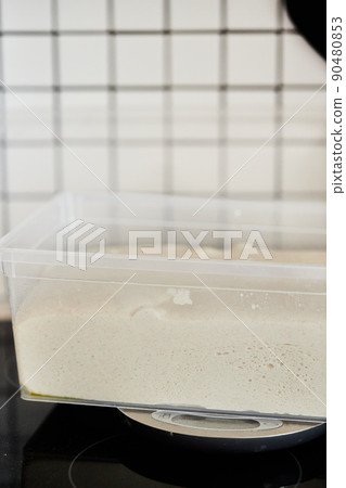 The process of making wheat bread at home. The concept of healthy homemade food. Vertical photo. The process of making wheat bread at home. The concept of healthy homemade food. Vertical photo. 90480853