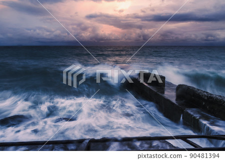 Storm at sea at sunset. Sea view with waves during rain and cloudy in Alupka. Crimea 90481394