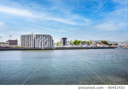 It is an urban landscape with a view of the direction of Enami Minamimachi. There are many condominiums on the riverside. Hiroshima It is an urban landscape with a view of the direction of Enami Minamimachi. There are many condominiums on the riverside. Hiroshima 90481483