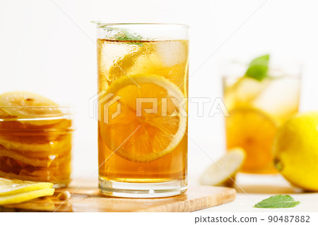 glass of ice lemon tea with mint. glass of ice lemon tea with mint. 90487882