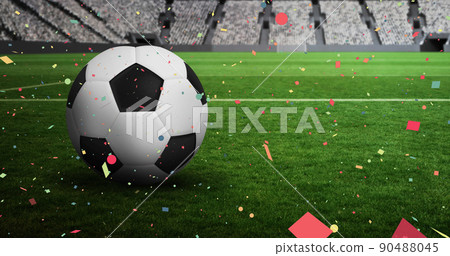 Colorful confetti falling against over close up of soccer ball in sports stadium 90488045