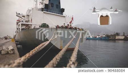Drone carrying a box in a port Drone carrying a box in a port 90488084