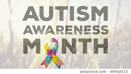 Image of autism colourful puzzle pieces and text on grass background 90488553