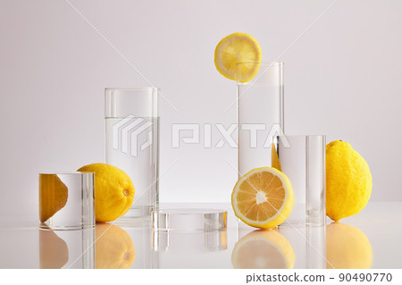 White Background  for Biological experiment presentation lemon extract and yellow water in biological test tubes. Production of cosmetics based on citrus.  90490770