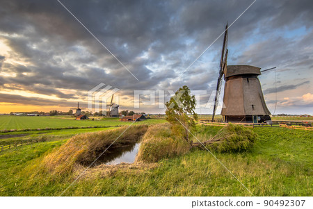 Three Traditional wooden windmills Three Traditional wooden windmills 90492307