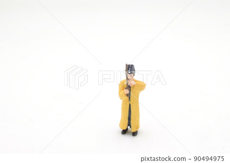 a scale of mini Taoist priest figure on board a scale of mini Taoist priest figure on board 90494975