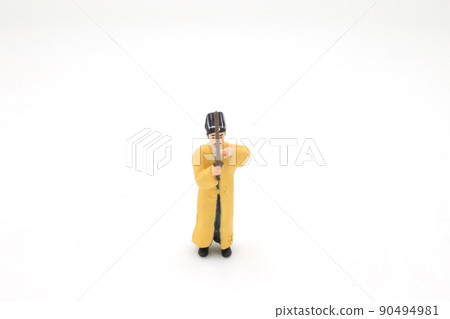 a scale of mini Taoist priest figure on board a scale of mini Taoist priest figure on board 90494981