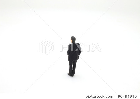 a man wearing business suit and tie winking 90494989
