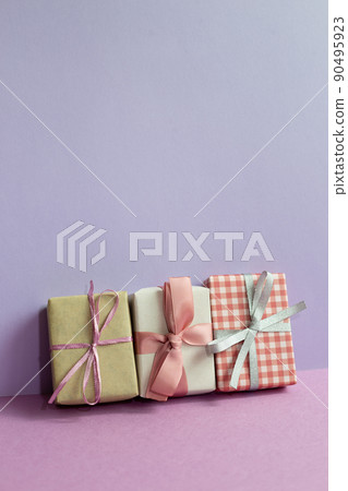 Gift boxes on purple table. purple wall background. copy space Gift boxes on purple table. purple wall background. copy space 90495923