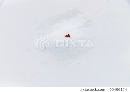 one freeride skier skiing downhill trough deep fresh powder 90496124