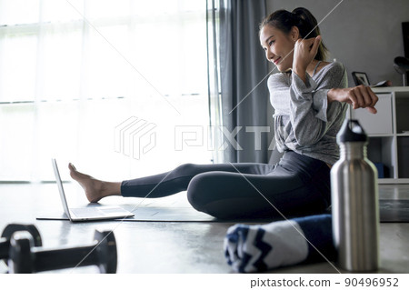 Asian woman exercising at home Asian woman exercising at home 90496952