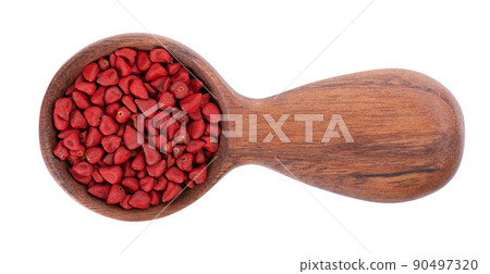 Annatto seeds in wooden spoon, isolated on a white background. Achiote seeds, bixa orellana. Natural dye for cooking and food. Close-up. Top view. Annatto seeds in wooden spoon, isolated on a white background. Achiote seeds, bixa orellana. Natural dye for cooking and food. Close-up. Top view. 90497320