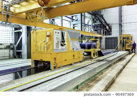 automated line for the production of hollow core slabs; a premises inside the plant with new equipment with remote control for engineer of control floor slab production process. automated line for the production of hollow core slabs; a premises inside the plant with new equipment with remote control for engineer of control floor slab production process. 90497369
