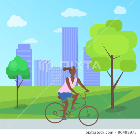 Afro-American Woman Riding on Bike in City Park 90498973