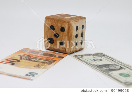 Homemade dice lies on banknotes, unpredictability of financial markets 90499068