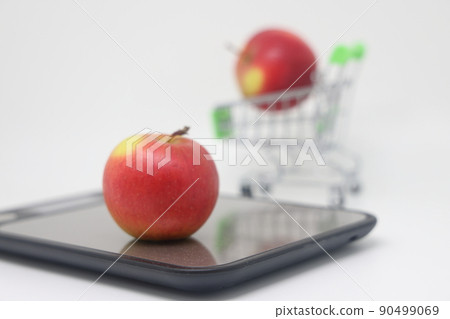 Apples on electronic kitchen scales on a white background, proper nutrition. 90499069