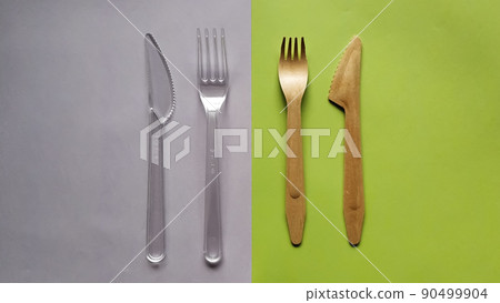 Contrast plastic and bamboo wooden fork knife. Eco-friendly disposable cutlery Contrast plastic and bamboo wooden fork knife. Eco-friendly disposable cutlery 90499904