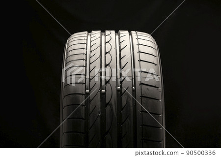 new summer tire on a black background, front view 90500336