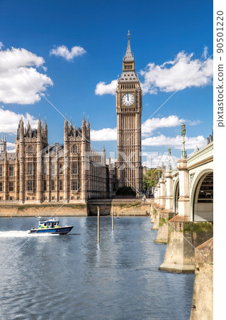 Famous Big Ben with bridge over Thames and tourboat on the river in London, England, UK 90501220