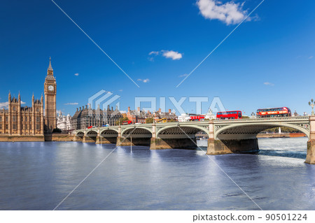 Famous Big Ben with red buses on bridge over Thames river in London, England, UK Famous Big Ben with red buses on bridge over Thames river in London, England, UK 90501224