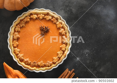 Homemade tasty pumpkin pie with ingredients for Thanksgiving Day. Homemade tasty pumpkin pie with ingredients for Thanksgiving Day. 90501602