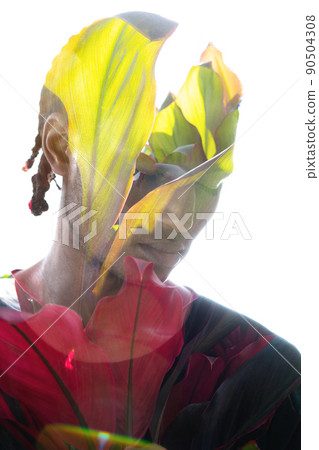 Creative double exposure portrait of a man and tropical plants Creative double exposure portrait of a man and tropical plants 90504308