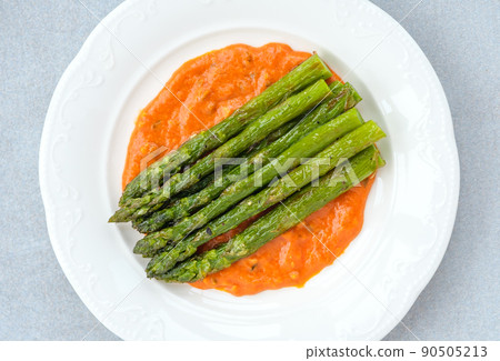 Fried asparagus with romesco sauce 90505213