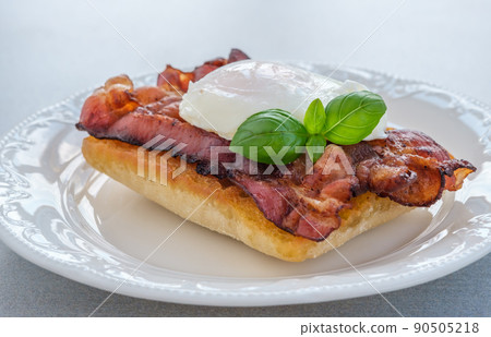 Sandwich with poached egg and bacon Sandwich with poached egg and bacon 90505218