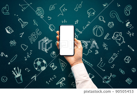 School icons set drawing on chalkboard and hand holding smartphone with blank screen for websites or 90505453