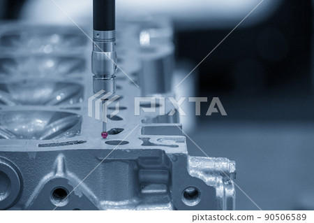 The  CMM machine measuring the cylinder head parts . 90506589