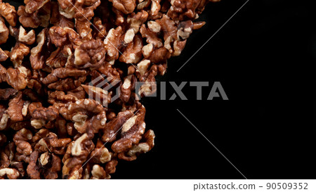 Walnuts isolated on black background. Walnuts isolated on black background. 90509352