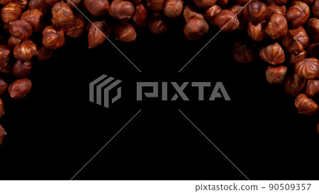 Hazelnuts isolated on black background. 90509357