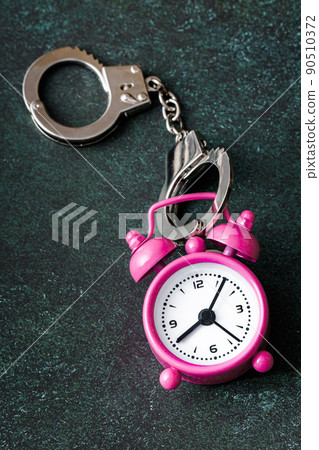 The alarm clock is handcuffed The alarm clock is handcuffed 90510372