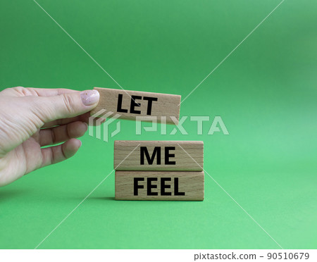 Feel symbol. Wooden blocks with words 'Let me feel'. Beautiful green background. Businessman hand. Psychology and let me feel concept. Copy space. 90510679