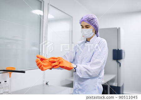 Scientists work in the laboratory. Remove the biomaterial from the freezer Scientists work in the laboratory. Remove the biomaterial from the freezer 90511045
