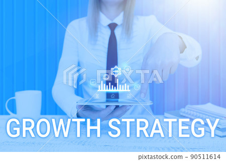 Text caption presenting Growth Strategy. Business approach Strategy aimed at winning larger market share in shortterm Man holding Screen Of Mobile Phone Showing The Futuristic Technology. Text caption presenting Growth Strategy. Business approach Strategy aimed at winning larger market share in shortterm Man holding Screen Of Mobile Phone Showing The Futuristic Technology. 90511614