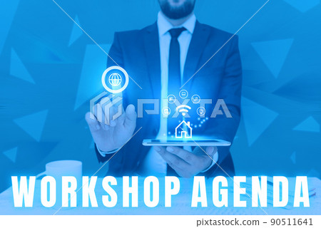 Hand writing sign Workshop Agenda. Word Written on helps you to ensure that your place stays on schedule Man holding Screen Of Mobile Phone Showing The Futuristic Technology. 90511641